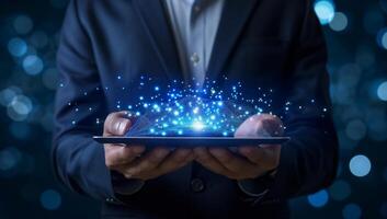 AI generated Businessman holding a tablet with blue glowing lights on a dark background photo