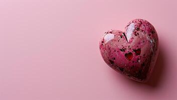 ai generado un moteado corazón conformado objeto en un rosado antecedentes foto