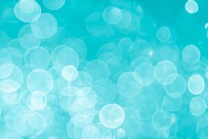 abstract aqua blue background with soft blur bokeh light effect photo