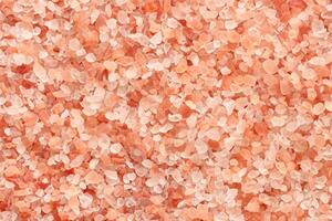 Close up top view of himalayan pink salt texture background with high resolution. photo