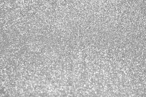 Abstract blur silver glitter sparkle defocused bokeh light background photo