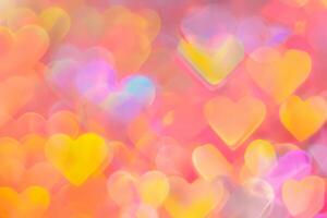 blurred heart shaped holographic bokeh lights background photo