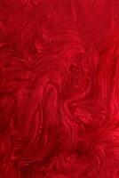 Vertical red shimmer abstract background. Make up concept.Beautiful stains of liquid nail laquers.Fluid art,pour painting technique.Horizontal banner,can be used as backdrop for chat. photo