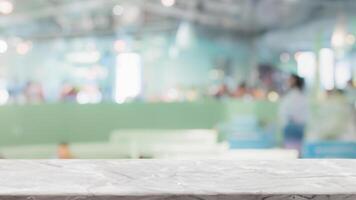 Empty white marble stone table top and blur glass window interior restaurant banner mock up abstract background - can used for display or montage your products. photo