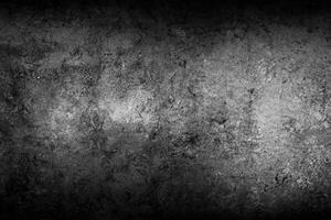 Black textured stone wall background photo