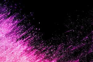 Abstract colorful powder explosion on black background.Freeze motion of dust splash.Painted Holi. photo