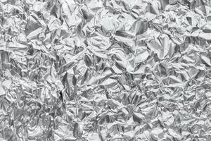 Shiny metal silver gray foil crumpled texture background photo