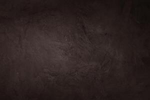 Dark brown slate rock texture with high resolution, background of natural stone wall. photo