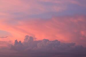 Colorful evening landscape with soft pastel coloured cloudscape on watercolor tinted sunset sky. Abstract nature background photo