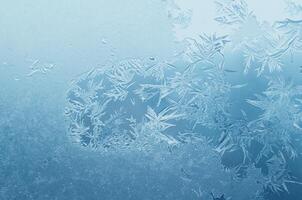 Abstract frosty pattern on glass, background texture photo