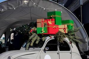 Minsk, Belarus, January 19, 2024 - Citroen with Christmas tree and festive boxes photo