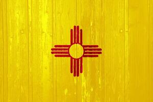 Flag of New Mexico state USA on a textured background. Concept collage. photo