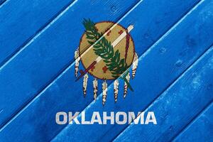 Flag of Oklahoma state USA on a textured background. Concept collage. photo