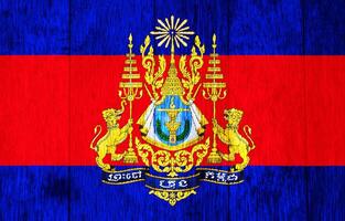 Flag and coat of arms of Kingdom of Cambodia on a textured background. Concept collage. photo