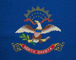 Flag of North Dakota state USA on a textured background. Concept collage. photo