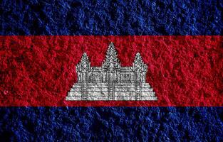 bandera de Reino de Camboya en un texturizado antecedentes. concepto collage. foto