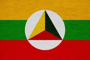 bandera y Saco de brazos de Shan estado en un texturizado antecedentes. concepto collage. foto