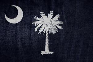 Flag of South Carolina USA state on a textured background. Concept collage. photo