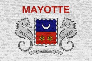 Flag of Mayotte on a textured background. Concept collage. photo