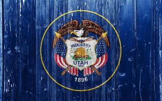 Flag of Utah USA state on a textured background. Concept collage. photo