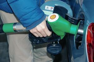 Bratislava, Slovakia - 01.12.2024 Refueling the car at a gas station fuel pump. photo