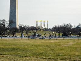 Washington, DC, USA - 12.16.2023 A large menorah and the Washington Monument. photo