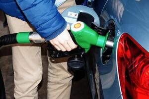 Bratislava, Slovakia - 01.12.2024 Refueling the car at a gas station fuel pump. photo