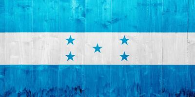 bandera de república de Honduras en un texturizado antecedentes. concepto collage. foto
