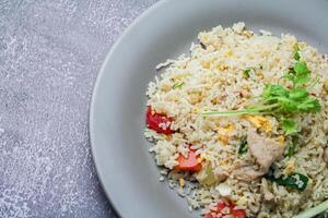 Pork fried rice is served in dishes in restaurants in Thailand, fried rice is a common street food in Thailand. photo