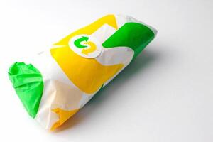 Bangkok, Thailand - January 07 2024 - Subway Sandwiches, delicious food Popular in America and around the world, Subway sandwiches come in wrappers with the Subway logo on a white background. photo