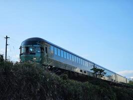 HITA, JAPAN  NOVEMBER 11, 2023 Yufuin No Mori Train. It is a sightseeing train linking Hakata Station in Fukuoka Prefecture and Yufuin. photo