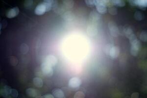 Blurred Sunlight and Beams with Bokeh Background. photo