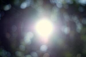 Blurred Sunlight and Beams with Bokeh Background. photo