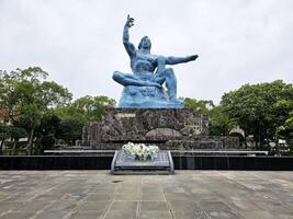 NAGASAKI, JAPAN NOVEMBER 16, 2023 Peace Statue at Nagasaki hypocenter park. It is a famous landmark of Nagasaki. photo