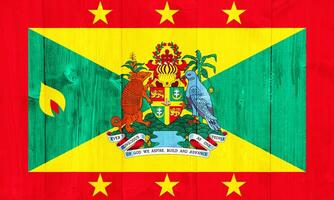 Flag and coat of arms of Grenada on a textured background. Concept collage. photo