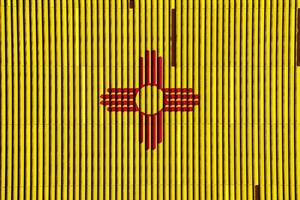 Flag of New Mexico state USA on a textured background. Concept collage. photo
