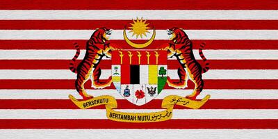 Flag and coat of arms of Malaysia on a textured background. Concept collage. photo