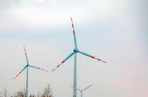 Wind turbine station windmill park next to the road in Austria in cloudy weather. photo