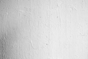 White Plaster Stucco Wall Texture Background with Light Beam from Right. photo