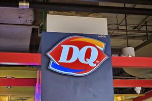 BANGKOK, THAILAND SEPTEMBER 09, 2023 Dairy Queen Sign. It is a famous American multinational fast food chain that was founded in 1940. photo