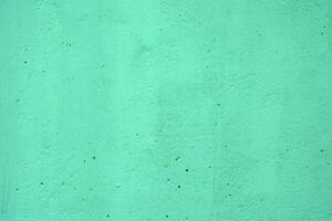 Green Aquamarine Color on Concrete Wall Texture Background. photo