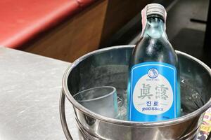 BANGKOK, THAILAND AUGUST 14, 2023 Jinro is back in Ice Bucket. Jinro is back is a original Korean soju, Since 1924. photo