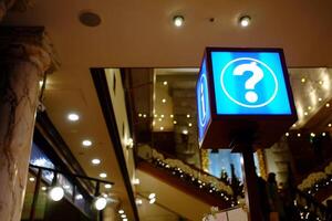 Information Sign and Help Desk at Hallway of Mall. photo