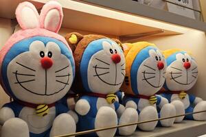 BANGKOK, THAILAND AUGUST 23, 2023 Doraemon Dolls on the Shelf. Doraemon is a Japanese manga series written and illustrated by Fujiko F. Fujio. photo