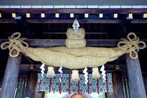 Shimenawa Sacred Ropes in front of Hokkaido shrine Mikado where is a tourist attraction in Sapporo, Japan. photo