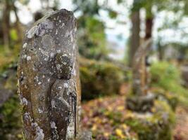 Ancient Monk Statue in the Park at Bussanji Temple. It is a landmark of Yufuin. photo