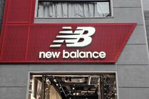 FUKUOKA, JAPAN NOVEMBER 14, 2023 New Balance sign. New Balance is a famous sports footwear, was founded in 1906. photo