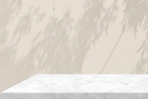 White Marble Table Corner with Tree Shadow and Bokeh on Broken Concrete Wall Background in Set Sail Champagne Color Tone, Suitable for Product Presentation Backdrop, Display, and Mock up. photo