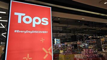 BANGKOK, THAILAND AUGUST 02, 2023 Tops Sign. Tops is a famous a grocery chain in Thailand that was founded in 1996. photo