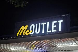 BANGKOK, THAILAND  OCTOBER 22, 2023 Mc Outlet sign. Mc Jeans is a famous Thai jeans brand in Thailand. photo